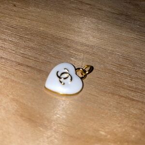 White and gold chanel zipper pull